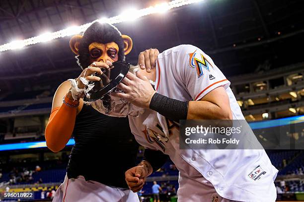 Chris Johnson of the Miami Marlins if covered with shaving cream by Miguel Rojas after hitting a walk-off double to end the game against the San...