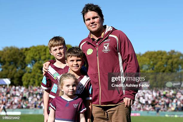 Jamie Lyon poses for a photo with his family during the round 25 NRL match between the Manly Sea Eagles and the Canberra Raiders at Brookvale Oval on...