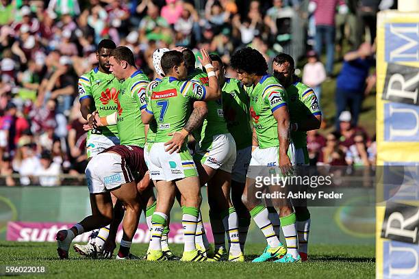 Raiders celebrate a try from Paul Vaughan during the round 25 NRL match between the Manly Sea Eagles and the Canberra Raiders at Brookvale Oval on...