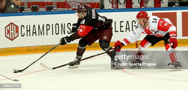 Andrej Kudrna of the HC Sparta Prague skates with puck with Bartosz Dabkowski of Comarch Cracovia during the Champions Hockey League match between...