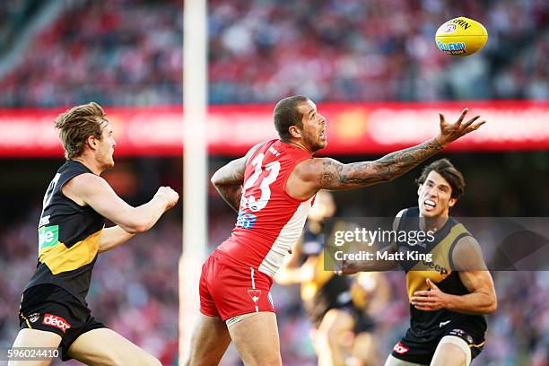 Lance Franklin of the Swans handles the ball during the round 23 AFL match between the Sydney Swans and the Richmond Tigers at Sydney Cricket Ground...