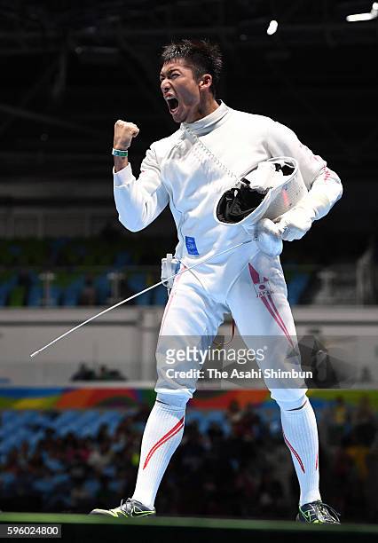 Kazuyasu Minobe of Japan celebrates winning against Marco Fichera of Italy in the Men's Epee Individual Table of 32 match on Day 4 of the Rio 2016...