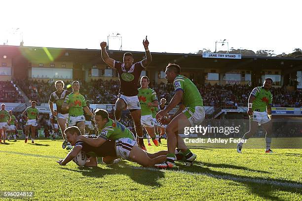 Tom Trbojevic of the Sea Eagles scores a try during the round 25 NRL match between the Manly Sea Eagles and the Canberra Raiders at Brookvale Oval on...