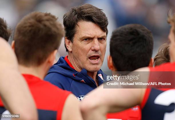 Paul Roos, Senior Coach of the Demons addresses his players during the 2016 AFL Round 23 match between the Geelong Cats and the Melbourne Demons at...