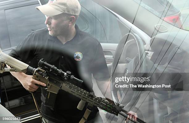 Todd Savage of Survival Retreat Consulting and American Redoubt Realty displays a firearm that he routinely takes with him on Thursday June 23, 2016...