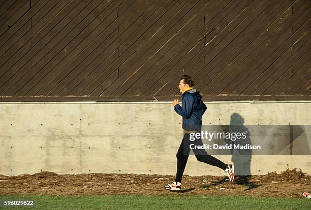 Kenny Moore warms up before competing in the Legends Mile event of the 1987 Oregon Twilight track meet held on May 17, 1987 at Hayward Field on the...