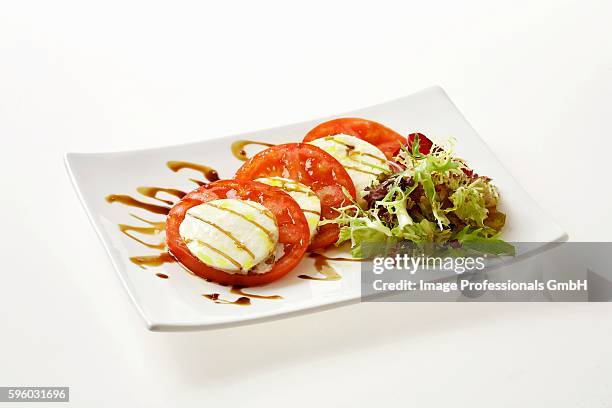 insalata caprese (tomatoes and mozzarella, italy) - insalata stock pictures, royalty-free photos & images