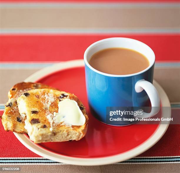 toasted teacake with tea (uk) - raisin toast stock pictures, royalty-free photos & images