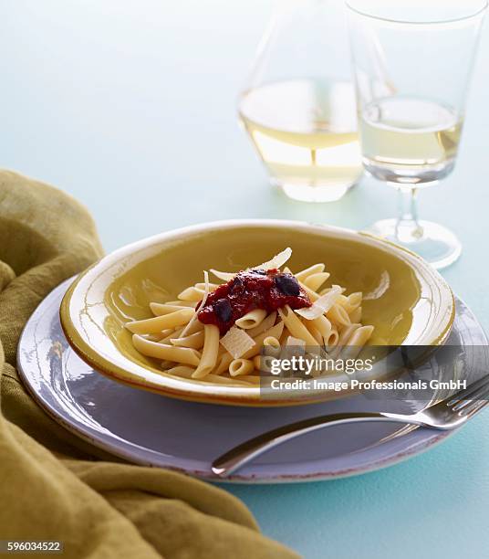 bowl of penne with sauce and shaved parmesan - shaved parmesan stock pictures, royalty-free photos & images