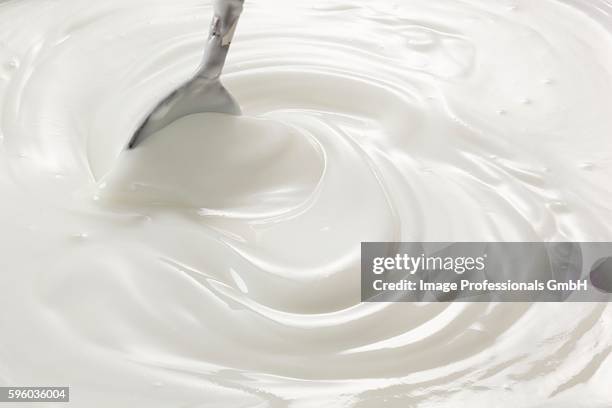 natural yogurt being stirred with a spoon - stirring stock pictures, royalty-free photos & images