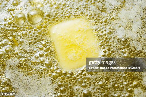 heating butter and oil in frying pan - melting pot foto e immagini stock