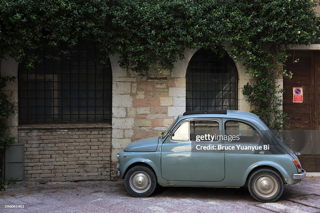 An old car parking on street of Assisi