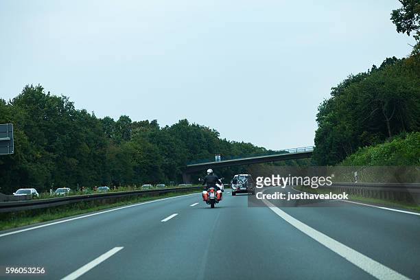 motorcycle going to overtake car - overtaking stock pictures, royalty-free photos & images