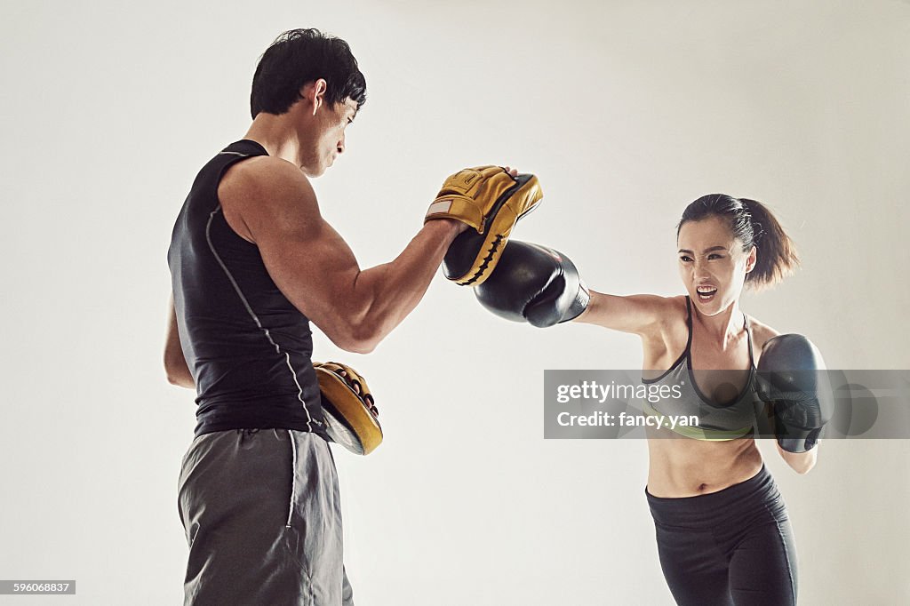 Boxer training with coach