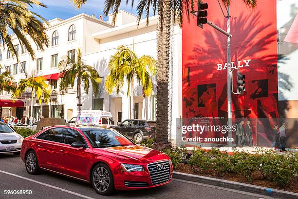 people and cars on famous  rodeo drive, ca, usa - audi beverly hills stock pictures, royalty-free photos & images