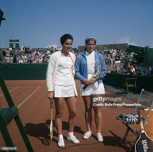 English tennis player Virginia Wade stands with American tennis player Valerie Ziegenfuss prior to their match at the 1968 British Hard Court...