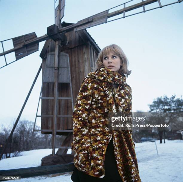 Swedish actress Bibi Andersson, who plays the role of Eva Vergerus in the Ingmar Bergman film 'The Passion of Anna', pictured wearing a knotted...