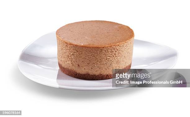 mini pumpkin cheesecake on a white plate; white background - mini quiche stock pictures, royalty-free photos & images