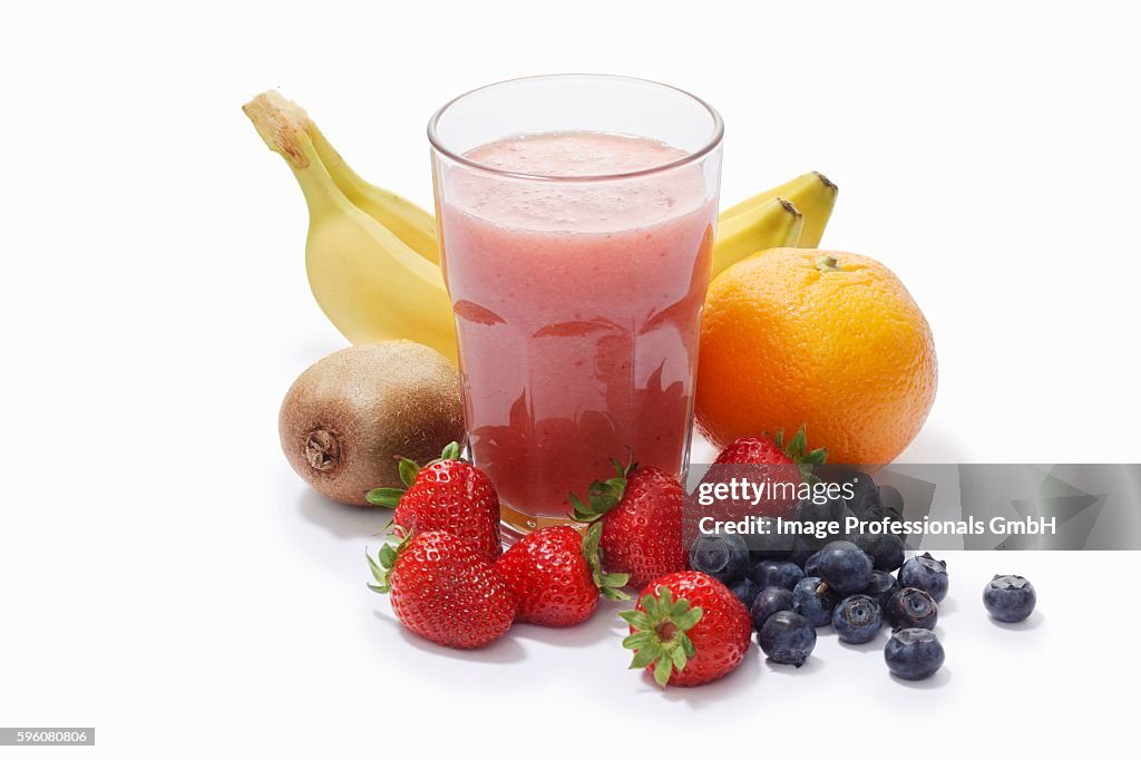 A banana, strawberry, blueberry, kiwi and grapefruit smoothie