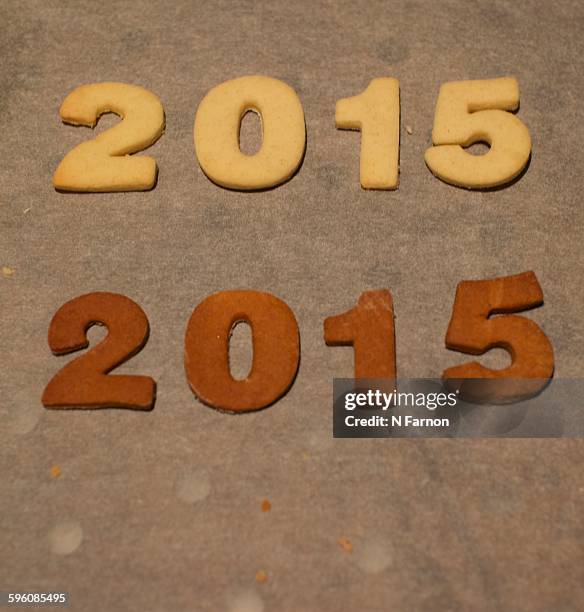light and shade of 2015 - burnt cookies stock pictures, royalty-free photos & images
