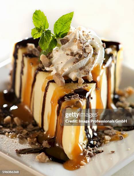 a slice of heath candy, caramel and chocolate cheesecake - caramel block stock pictures, royalty-free photos & images