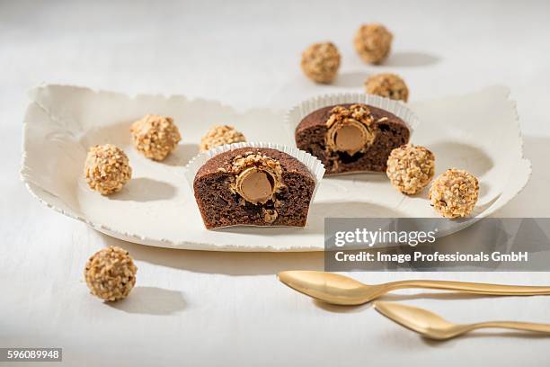 a cupcake with a praline-filled nut croquante in the middle - giotto di bondone stock pictures, royalty-free photos & images