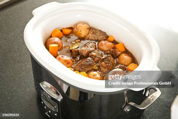 beef stew in a slow cooker - crock pot stock pictures, royalty-free photos & images