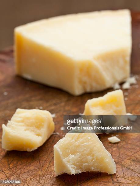 grana padano (hard italian cheese) on wooden board - grana padano bildbanksfoton och bilder