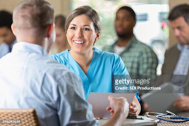 manager at hospital  interviewing potential nursing staff healthcare worker - interview event stock pictures, royalty-free photos & images