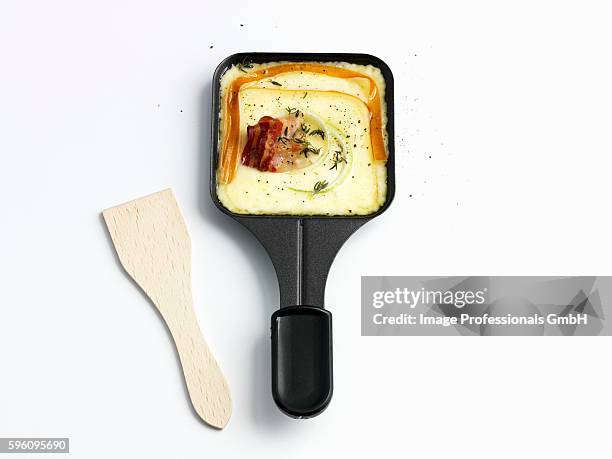 raclette with bacon - raclette stock-fotos und bilder