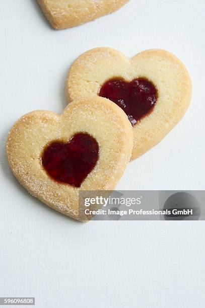 heart-shaped biscuits with cranberry jam - cranberry heart stock pictures, royalty-free photos & images