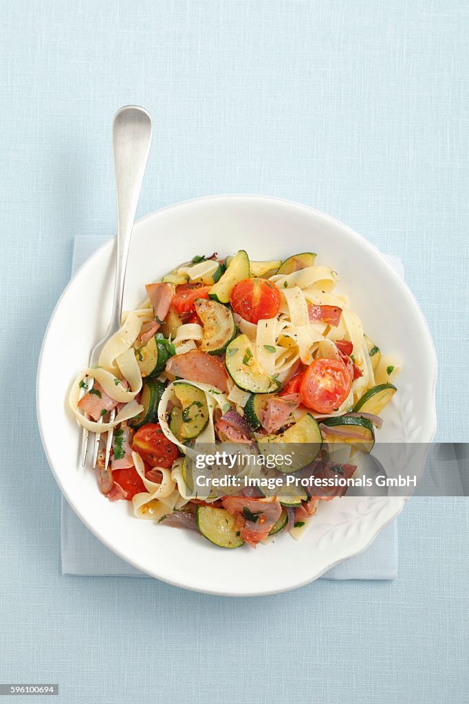 Tagliatelle with smoked ham, courgette and cherry tomatoes