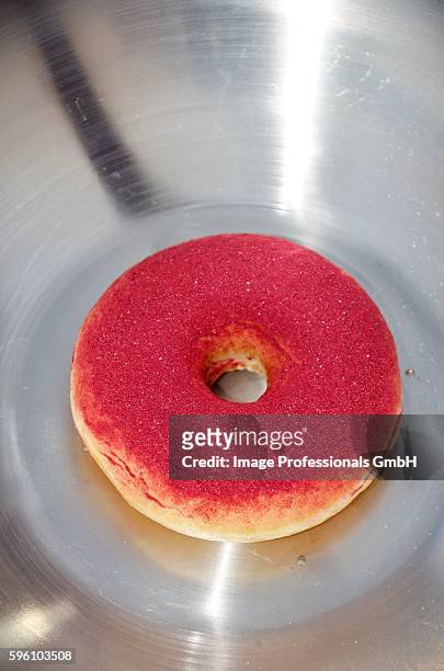 a doughnut dusted with cassis poweder - cassis fruit stock-fotos und bilder