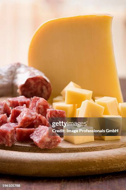 cheese and salami, cubed and whole - cheese cubes stock pictures, royalty-free photos & images