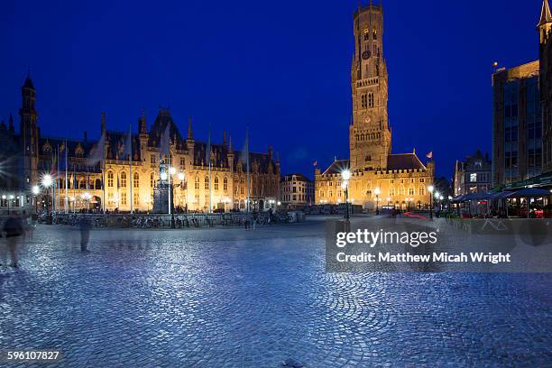 the city center of bruges at night. - incidental people stock pictures, royalty-free photos & images