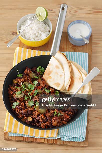 chilli con carne with tortillas and rice - ground beef stew stock pictures, royalty-free photos & images