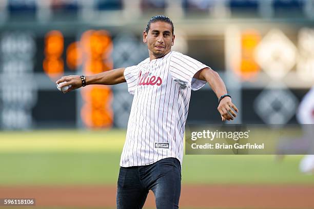 Alejandro Bedoya of the Philadelphia Union throws the ceremonial first pitch of the game between the Los Angeles Dodgers and the Philadelphia...