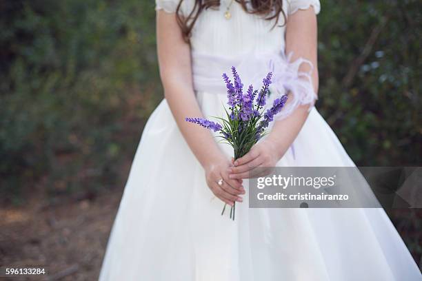 little girl with a bouquet - comunhão imagens e fotografias de stock