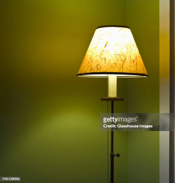 illuminated floor lamp with shade - floor lamp stock-fotos und bilder