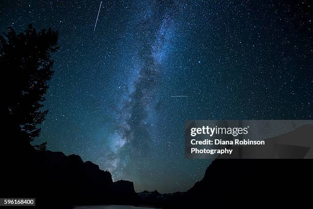 milky way and meteors over wild goose island, montana - meteor shower stock pictures, royalty-free photos & images