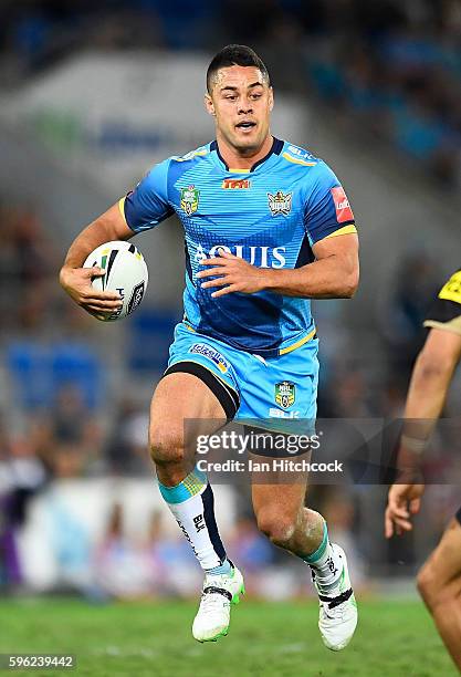 Jarryd Hayne of the Titans runs the ball during the round 25 NRL match between the Gold Coast Titans and the Penrith Panthers at Cbus Super Stadium...