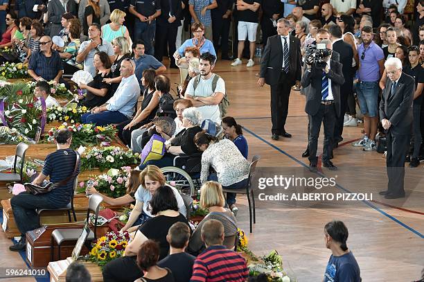 Italy's President Sergio Mattarella attends a funeral service for victims of the earthquake, at a gymnasium arranged in a chapel of rest on August 27...