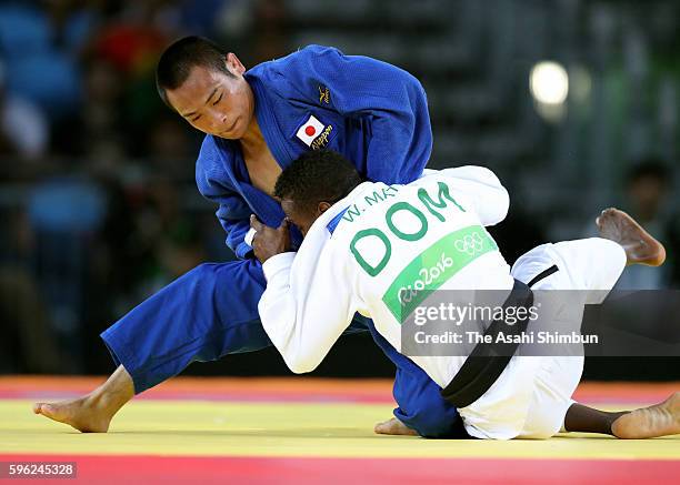 Masashi Ebinuma of Japan and Wander Mateo of the Dominican Republic compete in the Men's 66kg quarterfinal on Day 2 of the Rio 2016 Olympic Games at...