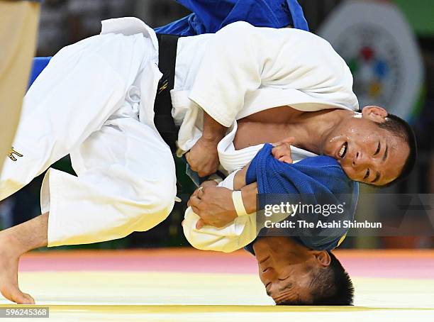 Masashi Ebinuma of Japan and Ma Duanbin of China compete in the Men's 66kg third round on Day 2 of the Rio 2016 Olympic Games at Carioca Arena 2 on...