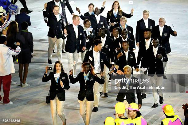 Refugee Olympic Team enters the stadium during the Opening Ceremony of the Rio 2016 Olympic Games at Maracana Stadium on August 5, 2016 in Rio de...