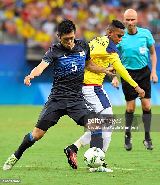 Naomichi Ueda of Japan and Teofilo Gutierrez of Colombia compete during 2016 Summer Olympics match between Japan and Colombia at Arena Amazonia on...