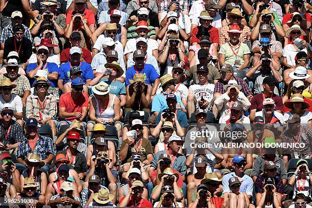 People attend the first day of the Federal Alpine Wrestling Festival on August 27, 2016 in Payerne, western Switzerland. More than 200,000 spectators...