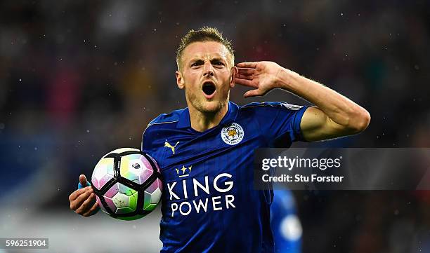 Jamie Vardy of Leicester City celebrates scoring his sides first goal during the Premier League match between Leicester City and Swansea City at The...