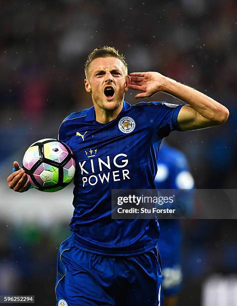 Jamie Vardy of Leicester City celebrates scoring his sides first goal during the Premier League match between Leicester City and Swansea City at The...