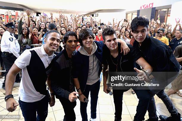 Musical group CNCO performs at the meet and greet fans at Miami International Mall on August 26, 2016 in Miami, Florida.